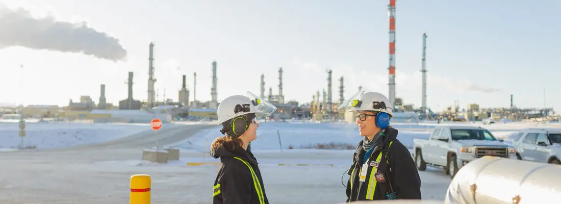 A group of female power engineers work on a task.